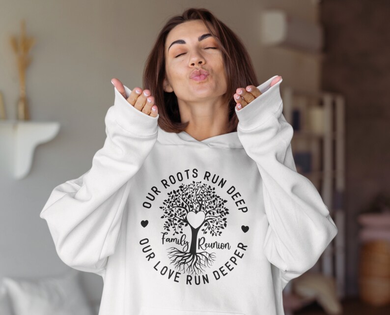 May include: White hoodie with a black tree design and the text "Our roots run deep, our love run deeper, Family Reunion".