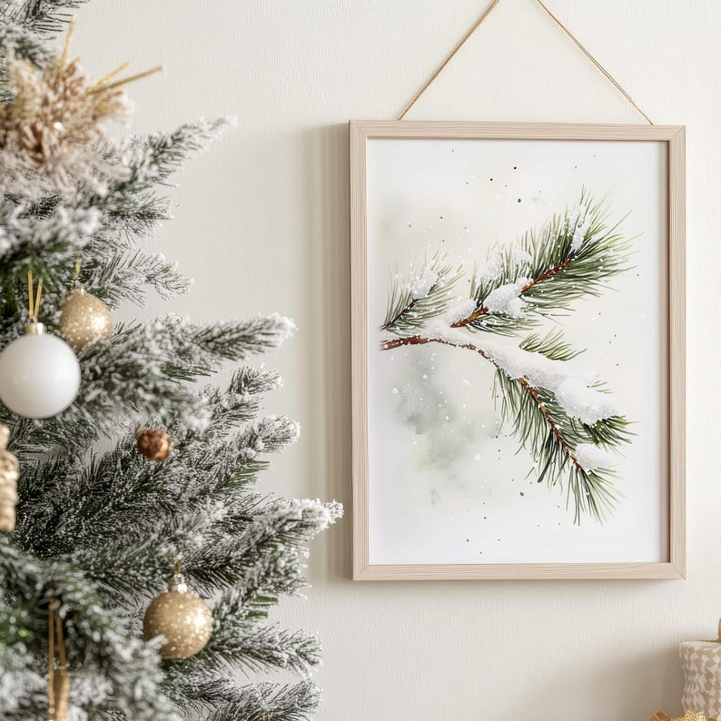 May include: A watercolor painting of a pine branch with snow on it. The background is a light green and white with a watercolor effect. The painting is framed in a light wood frame.