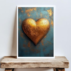 May include: A framed artwork featuring a large, textured gold heart against a teal and gold abstract background. The heart is the focal point, with visible brushstrokes and a metallic sheen. The artwork is displayed on a rustic wooden surface.
