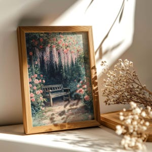 May include: A framed print of a painting depicting a wooden bench under a wisteria trellis with pink flowers. The bench is in a garden setting with green foliage and a path leading away from the bench.