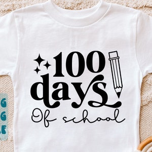 May include: White t-shirt with black text that reads "100 days of school" with a pencil graphic and two stars.