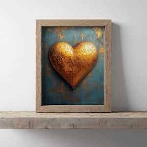 May include: A framed artwork featuring a textured, golden heart against a teal and gold background. The heart is the focal point, set within a wooden frame, creating a striking visual contrast. The artwork is displayed on a wooden shelf.