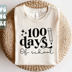 May include: A white t-shirt with black text that reads "100 days of school" with a pencil and stars graphic.