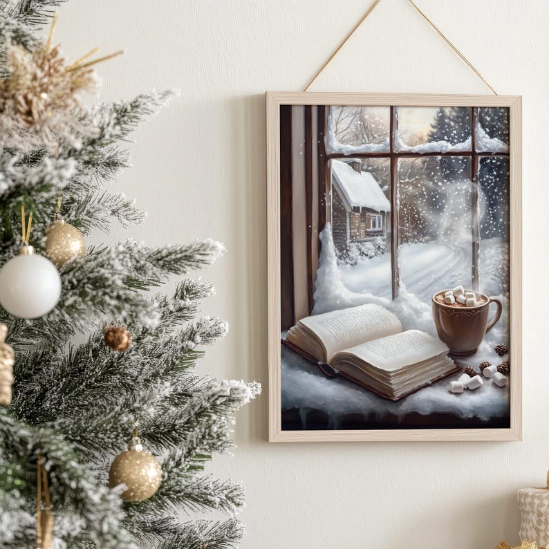 May include: A framed painting of a snowy winter scene viewed from a window. The window is open and there is a book and a mug of hot chocolate with marshmallows on the windowsill. The scene outside the window shows a small cabin in the snow.