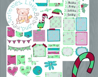 May include: A set of Christmas-themed planner stickers featuring a bear, elves, candy canes, and a banner. The stickers are on a white background with a woodgrain pattern.