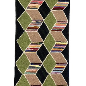 May include: A hand-woven rug with a geometric pattern of green, brown, and black diamonds. The diamonds are filled with colorful stripes.