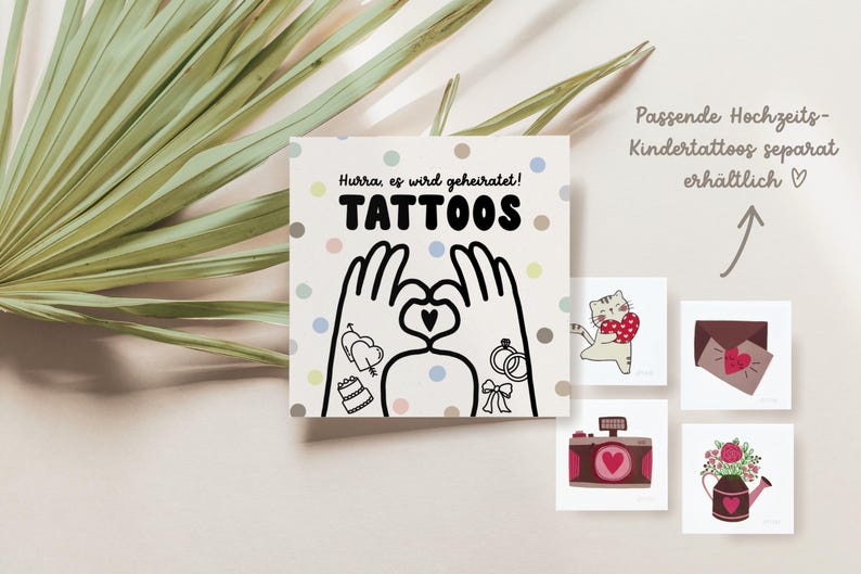 May include: A set of temporary tattoos with a wedding theme. The tattoos feature a couple holding hands with a heart, a wedding cake, a ring, and a bouquet of flowers. The text on the card reads "Hurray, we're getting married! Tattoos".