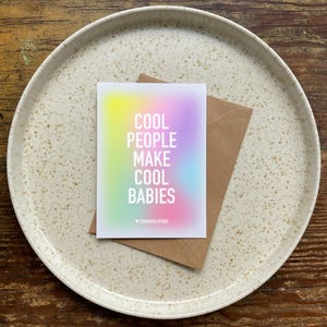 May include: A rainbow gradient card with the text "Cool People Make Cool Babies" and the word "Congratulations" at the bottom.