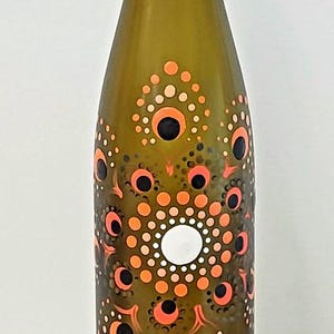Hand painted wine bottle with mandala dot design. Home Decoration
