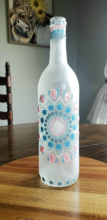 Hand painted wine bottle with a mandala dot design.  Blue and pink Home decoration
