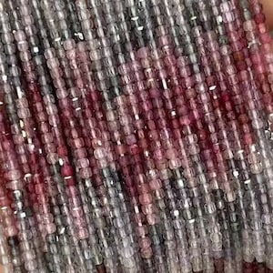 May include: A strand of pink and white gemstone beads. The beads are small and round, and they are strung on a clear thread. The beads are arranged in a random pattern, and they create a beautiful and delicate look.