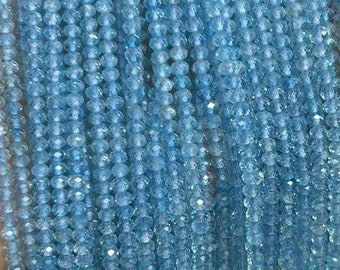 May include: A strand of light blue gemstone beads. The beads are faceted and have a round shape. The strand is approximately 18 inches long.