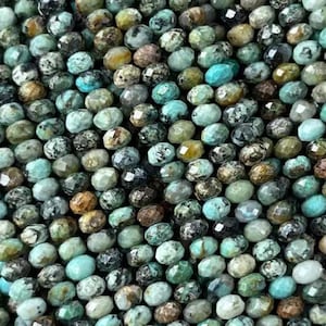 May include: A strand of small, round, faceted African turquoise beads. The beads are a mix of blue, green, and brown colors.