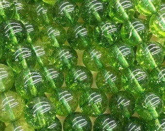 May include: A strand of green aventurine beads. The beads are round and have a sparkly, translucent finish.