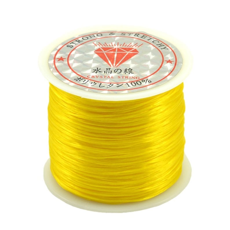 May include: A spool of bright yellow elastic string labeled "Strong & Stretchy" and "Crystal String".
