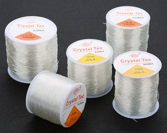 100M Élastique Rond Perlage Fort Clair / Rouge / Noir / Marron Cristal Stretchy Thread Cordon Cordon 0.5mm / 0.6mm / 0.7mm / 0.8mm / 1.0mm / 1.2mm / 1.5mm