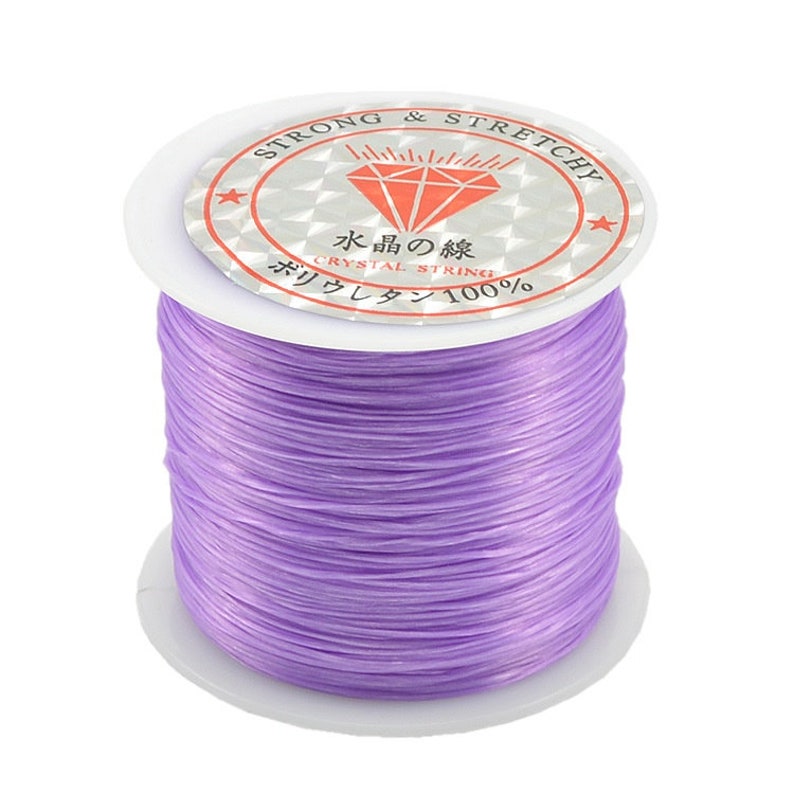 May include: A spool of purple elastic string labeled "Strong & Stretchy" and "Crystal String 100%".