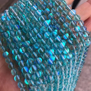1 brin complet de 15,5 en vrac rond lisse poli irisé rougeoyant Flash Fiery Mystic Aura perles de quartz pour la fabrication de bijoux 6 mm 8 mm 10 mm 12 mm Aqua Blue