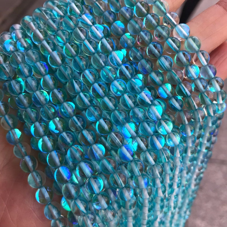 1 brin complet de 15,5 en vrac rond lisse poli irisé rougeoyant Flash Fiery Mystic Aura perles de quartz pour la fabrication de bijoux 6 mm 8 mm 10 mm 12 mm Aqua Blue