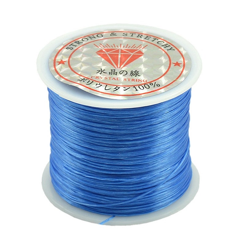 May include: A spool of blue elastic string for jewelry making. The label reads "Strong & Stretchy" and "Crystal String 100%".