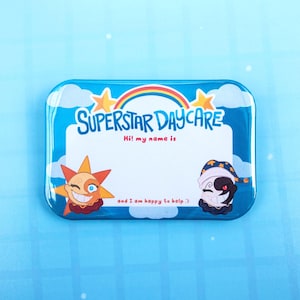 May include: A rectangular blue name tag badge featuring a rainbow, clouds, and two cartoon characters. The text reads SUPERSTAR DAYCARE, Hi! my name is, and and I am happy to help :). The left character is a sun, and the right is a moon figure.