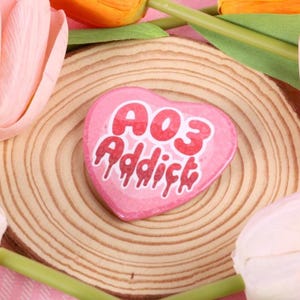 A03 Addict, Holographic Heart Shaped 57mm Button Badge | Ionzy's Studio