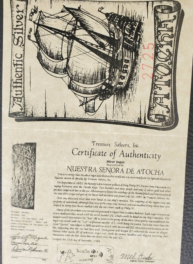 May include: A certificate of authenticity for a silver ingot recovered from the Nuestra Se&ntilde;ora de Atocha shipwreck. The certificate features a black and white illustration of the ship and includes the text "Nuestra Se&ntilde;ora de Atocha" and "Treasure Salvors, Inc."