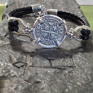 Atocha leather bracelet shipwreck treasure coin with shackles.