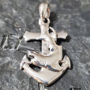 Silver anchor pendant with shark