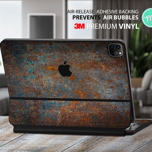 Puede incluir: Una piel para portátil con un diseño de metal oxidado, con un logotipo de 3M y el texto "Air-Release Adhesive Backing Prevents Air Bubbles 3M Premium Vinyl".