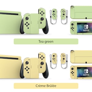 May include: Two Nintendo Switch consoles with different colored skins. The top console is a light green color with the text "Tea green" below it. The bottom console is a light yellow color with the text "Cr&egrave;me Br&ucirc;l&eacute;e" below it.