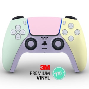May include: A pastel green, pink and yellow PlayStation 5 DualSense controller with a 3M Premium Vinyl sticker. The controller has a light purple base.