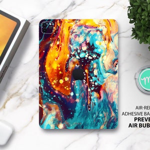 May include: A colorful abstract design iPad skin with a blue, yellow, orange, and red color scheme. The skin has a marbled effect with a glossy finish. The text "AIR-RELEASE ADHESIVE BACKING PREVENTS AIR BUBBLES" is printed on a white background.