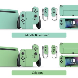 May include: Two Nintendo Switch consoles with different colored skins. The top console is a light blue-green color and the bottom console is a light green color. Both consoles have the Nintendo Switch logo on the front.