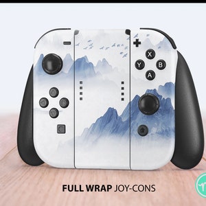 May include: A white Nintendo Switch Joy-Con controller with a blue and white mountain landscape design. The controller has black buttons and a black grip.