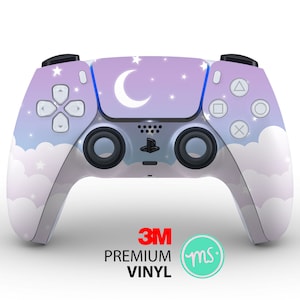 May include: A PlayStation 5 controller skin featuring a dreamy night sky design. The skin has a gradient of purple and blue with white clouds, stars, and a crescent moon. The controller has black buttons and joysticks. The text "3M Premium Vinyl" is visible.
