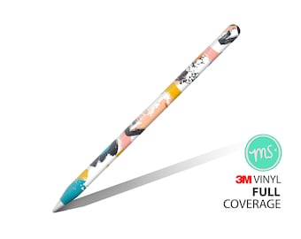 May include: A white Apple Pencil with a colorful abstract design. The design features splashes of blue, yellow, pink, and black paint. The pencil is covered in a 3M vinyl skin with full coverage.