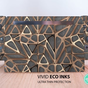 May include: A gold and gray geometric pattern Nintendo Switch console skin. The skin is ultra-thin and made with eco-friendly inks. The text "VIVID ECO INKS ULTRA THIN PROTECTION" is printed below the image.