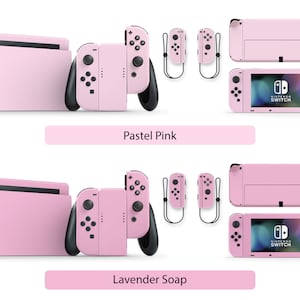 May include: Two sets of pink Nintendo Switch console skins, one set labeled "Pastel Pink" and the other labeled "Lavender Soap". Each set includes a console skin, two Joy-Con skins, and a screen protector.