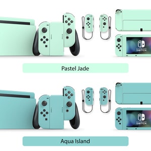 May include: Two Nintendo Switch consoles with different colored skins. The top console is a pastel green color with the text "Pastel Jade" below it. The bottom console is a lighter shade of green with the text "Aqua Island" below it.
