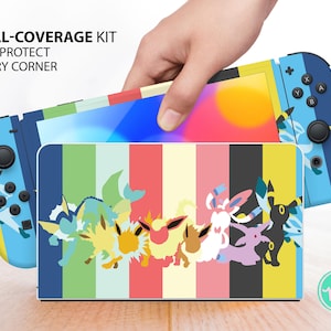 May include: A gaming console skin kit featuring a colorful vertical striped pattern with various stylized creature silhouettes. The text FULL-COVERAGE KIT FOR PROTECT EVERY CORNER is printed in black on the upper left side of the console skin.