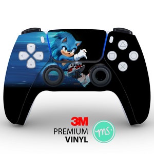 May include: A black and blue PlayStation 5 controller with a Sonic the Hedgehog design. The controller features a blue and black design with a Sonic the Hedgehog character on the front. The controller is made with 3M premium vinyl.
