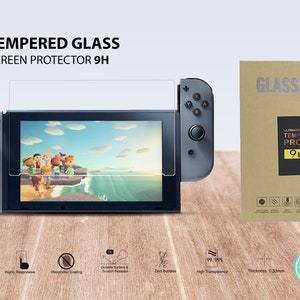 May include: Tempered glass screen protector for the Nintendo Switch, featuring a 9H hardness rating. The protector is shown on a gray Nintendo Switch console with a game screen displaying a cartoon image. The packaging includes the text "GLASS 9H FILM".