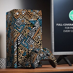 May include: A full-coverage skin decal for the Xbox Series X console. The decal features a geometric pattern in black, white, blue, and yellow. The text "FULL-COVERAGE KIT FOR PROTECT EVERY CORNER" is visible on the screen behind the console.