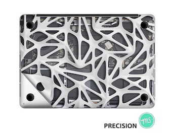 May include: A white laptop skin with a geometric pattern that resembles a web or a network. The skin is partially peeled back to reveal the laptop's internal components. The text "PRECISION" is visible at the bottom of the image.