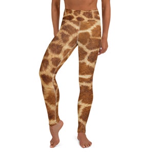 May include: High-waisted yoga leggings with a giraffe print. The leggings feature a brown and tan pattern, mimicking the natural markings of a giraffe. The leggings are designed for comfort and flexibility, suitable for various activities.