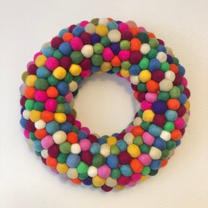 Rainbow felt ball Wreath 35cm available made with felt balls hand made in Nepal. 35 Centimeters