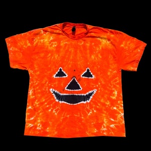 Made to order Halloween tie dye T-shirt . Orange and black Jack-o-lantern pumpkin tie dye T-shirt.