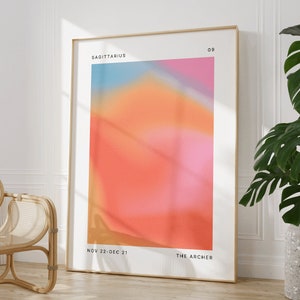 Może przedstawiać: Ramka z plakatem o abstrakcyjnym wzorze w kolorach r&oacute;żowym, pomarańczowym i niebieskim. Plakat zawiera tekst "Strzelec" i "Łucznik" oraz daty "Nov 22-Dec 21".