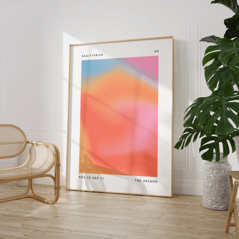 Może przedstawiać: Ramka z plakatem o abstrakcyjnym wzorze w kolorach r&oacute;żowym, pomarańczowym i niebieskim. Plakat zawiera tekst "Strzelec" i "Łucznik" oraz daty "Nov 22-Dec 21".